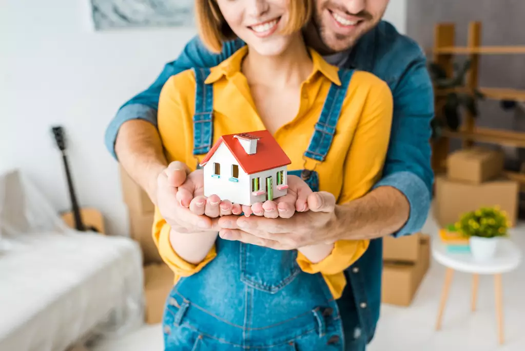 View smiling couple holding